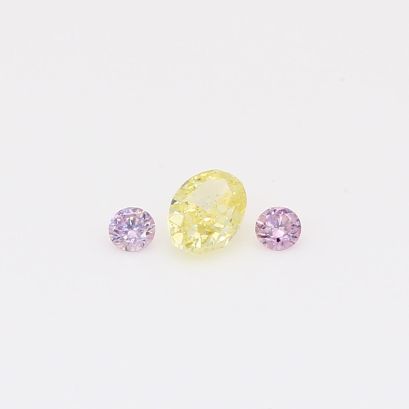 0.28 Total carat trio of round-cut purple and oval-cut fancy light yellow diamonds
