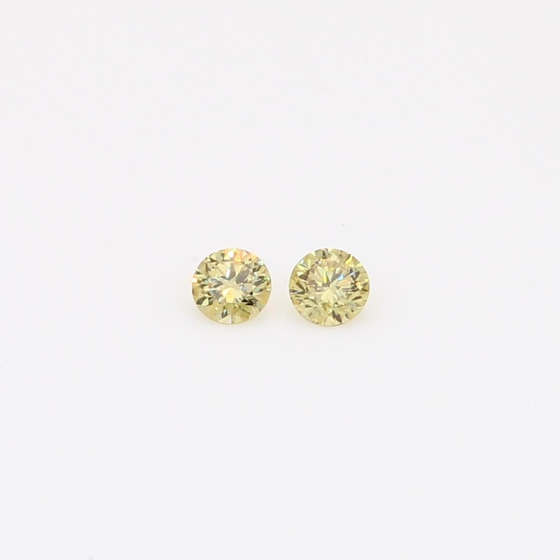 0.10 Total carat pair of round-cut fancy yellow diamonds