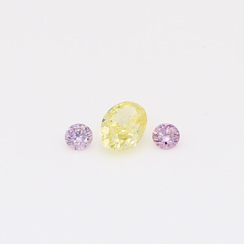 0.28 Total carat trio of round-cut purple and oval-cut fancy light yellow diamonds